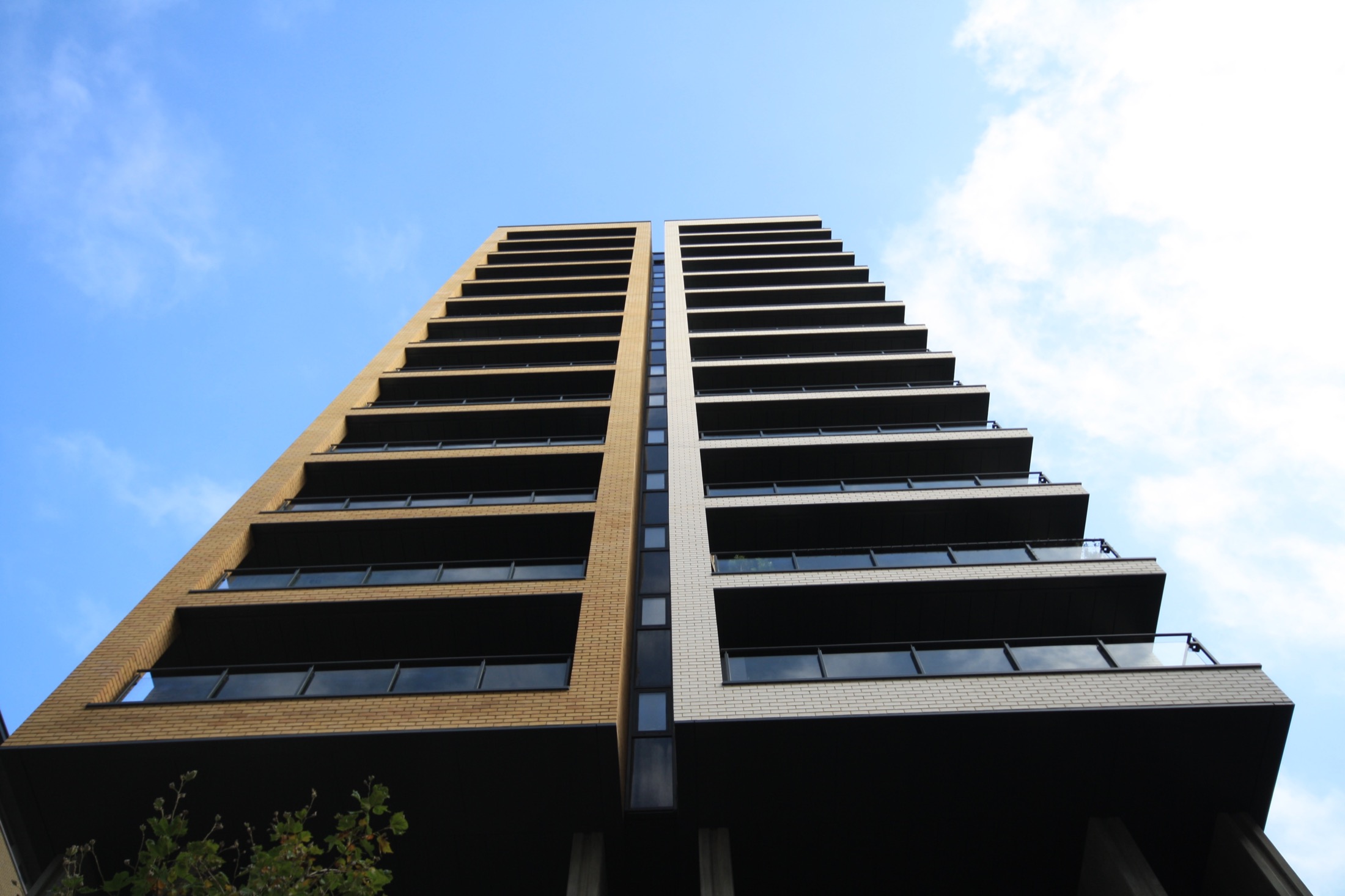 Suttons Wharf North, Bow, London E2 — rainscreen-clad residential tower.